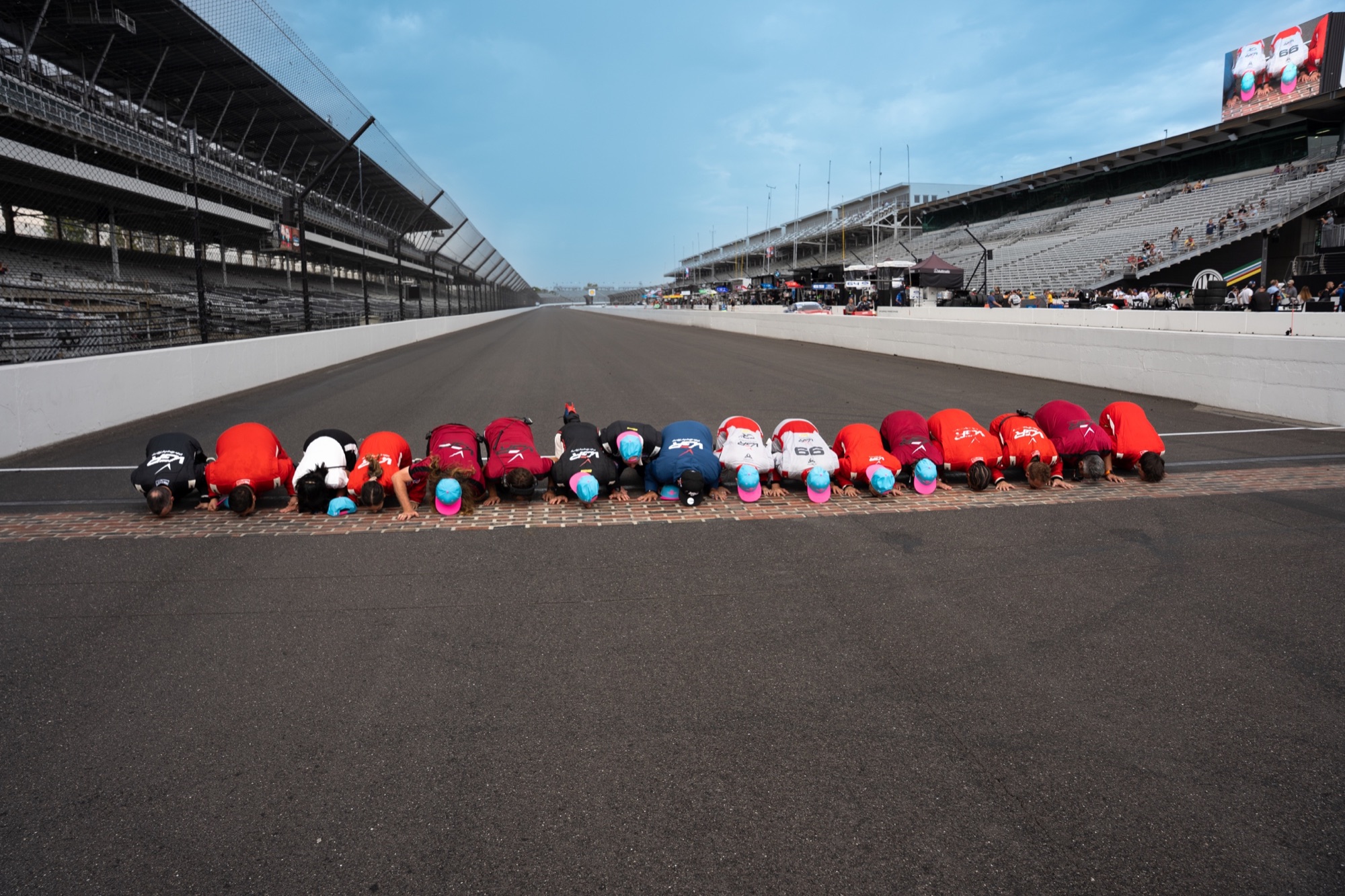 Victor Gonzalez Racing celebrates by kissing the bricks at Indianapolis Motor Speedway